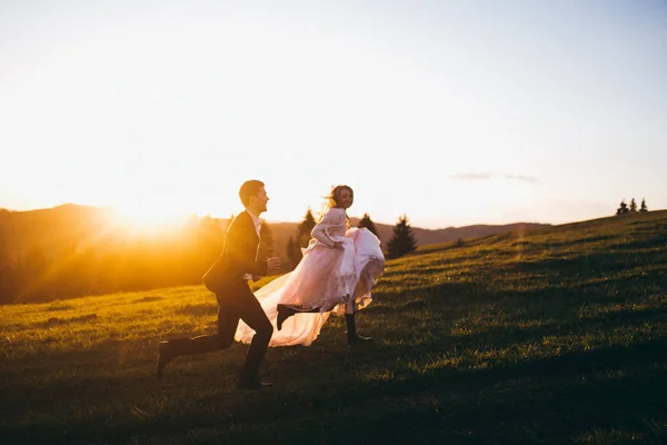 Young Couple Newlyweds Running Mountains Stock Image