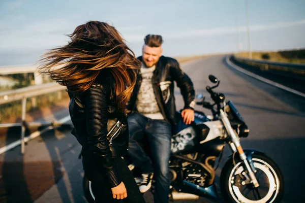 young beautiful couple of motorcycle  riders
