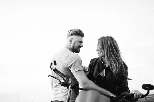 young beautiful couple of motorcycle  riders