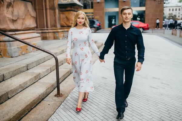 young beautiful couple walking  in  city