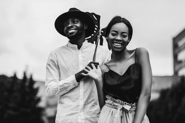 Lovely African Newlyweds Smiling Posing Outdoors Monstera Leaf Monochrome Portrait — Stock Photo, Image