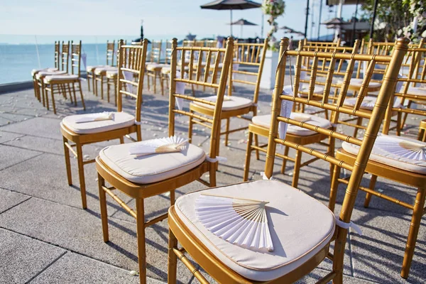 Wedding Chairs Gold Chinese Fan Souvenirs Cones Rose Petals — Stock Photo, Image