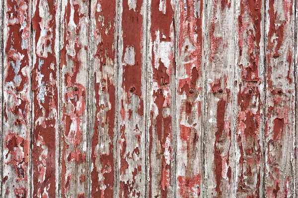 Vieux mur en bois peint avec peeling de couleur rouge foncé révélé texture rustique — Photo