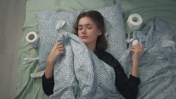 Sick Girl Lies Bed Covers Blows Her Nose Toilet Paper — Stock Video