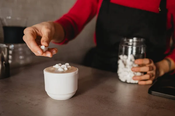Barista Adds Marshmallows to Coffee