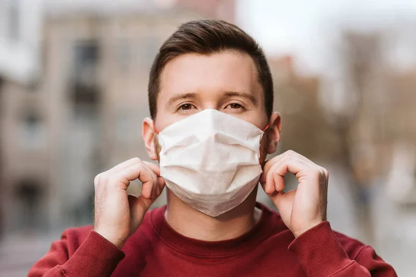 man wearing a white face shield