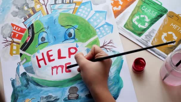 Young girl draws paints poster, environmental problem — ストック動画