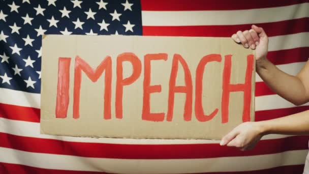 Impeach sign in female hands — ストック動画