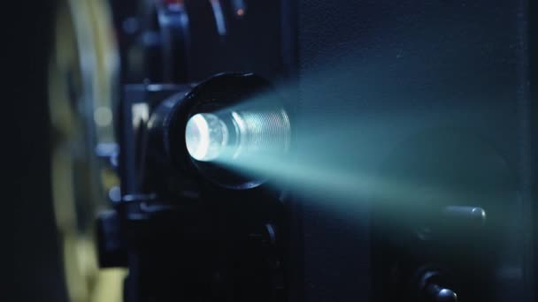 A projector lens with a ray of light close-up — Stock Video