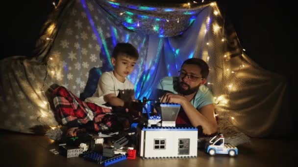 Father and son have fun time in the playroom — Stock Video