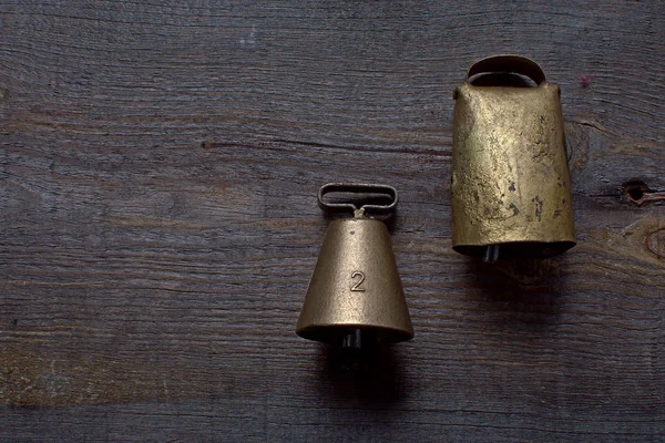 High quality bronze bell and swiss bell for bird dog lies on a w