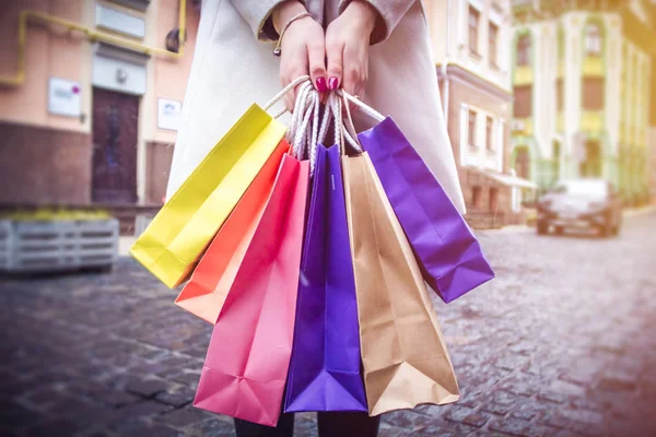 Woman in shopping. Happy girl holding shopping bags.