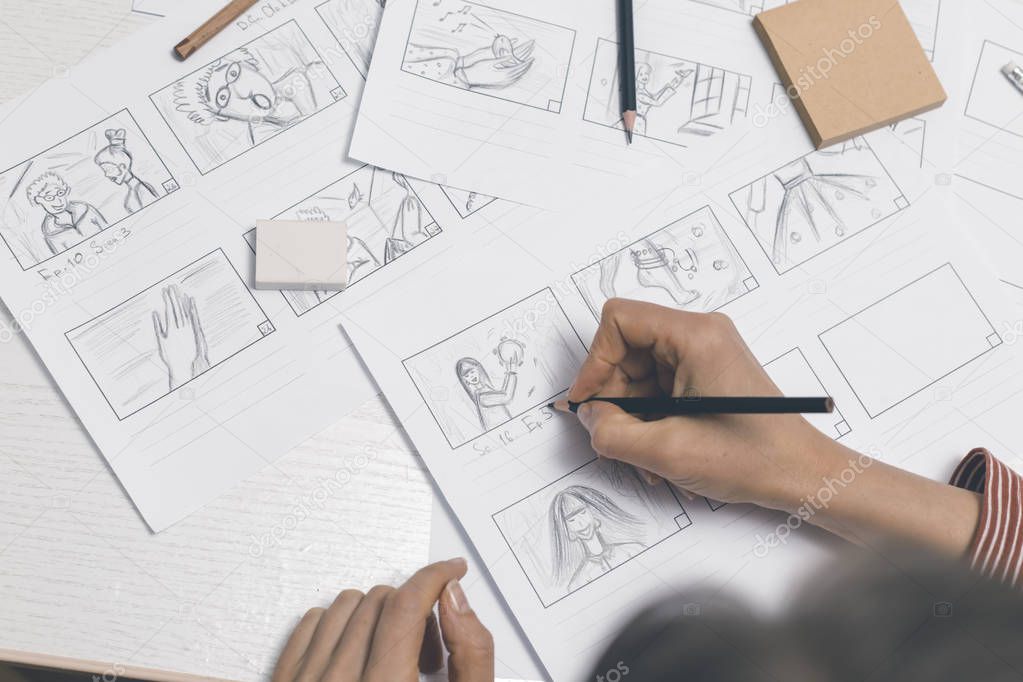 An animator artist draws storyboards.