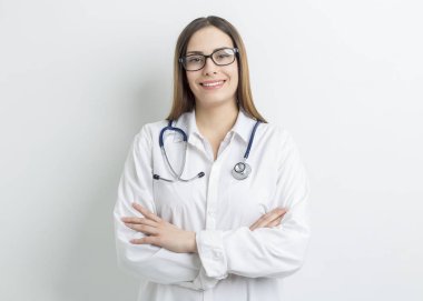 Portrait of a smiling and beautiful female doctor in a white coat. 