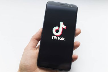 Ukraine, Kyiv - Dec. 22th, 2019 : Tik Tok logo on the phone screen. Application for creating short videos.