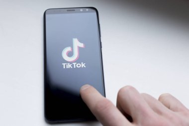 Ukraine, Kyiv - Dec. 22th, 2019 : Tik Tok logo on the phone screen. Application for creating short videos.