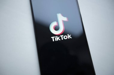 Ukraine, Kyiv - Dec. 22th, 2019 : Tik Tok logo on the phone screen. Application for creating short videos.