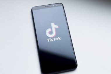 Ukraine, Kyiv - Dec. 22th, 2019 : Tik Tok logo on the phone screen. Application for creating short videos.