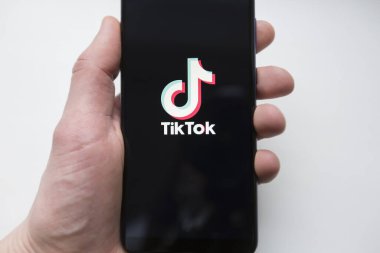 Ukraine, Kyiv - Dec. 22th, 2019 : Tik Tok logo on the phone screen. Application for creating short videos.