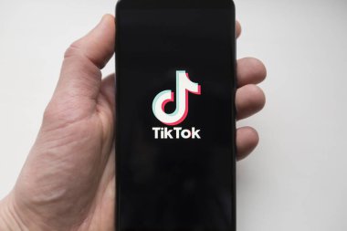 Ukraine, Kyiv - Dec. 22th, 2019 : Tik Tok logo on the phone screen. Application for creating short videos.