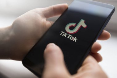 Ukraine, Kyiv - Dec. 22th, 2019 : Tik Tok logo on the phone screen. Application for creating short videos.