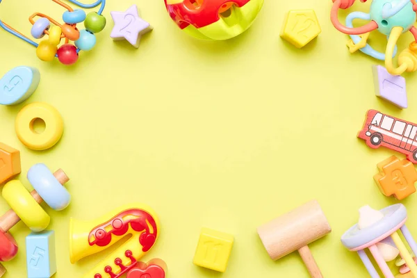 Top view on childrens toys on a blue background. Childrens toys on the table. concept for advertising toys for children. Copy space. childrens toy. — Stock Photo, Image