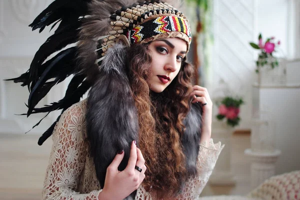 Native American woman. Indians of America. Feathers on the headdress. American style. Stylish girl. Life style. Beading.