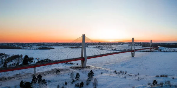 sunset in winter. Bridge over river. the sun will want. river in ice