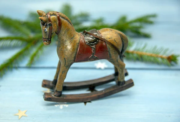 Christmas toy rocking horse and spruce branches