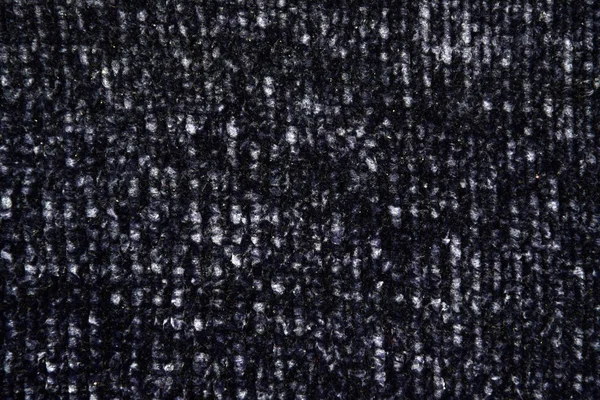 Full frame of knitted dark blue with white splashes sweater as a backdrop. Horizontal dark blue background pattern. — Stok fotoğraf