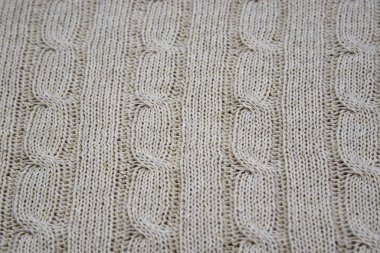 Full frame of knitted grey plaid as a backdrop. Horizontal grey background pattern.