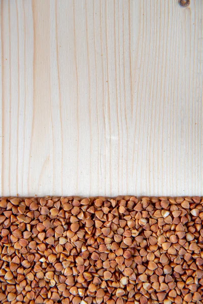 Raw Dry Buckwheat Grains Light Wooden Board Backdrop Use Background — Stock Photo, Image