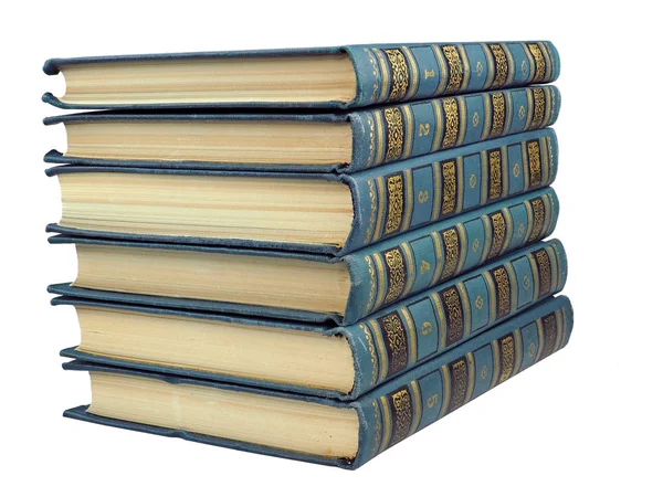 Pilha de livros antigos azuis isolados no fundo branco — Fotografia de Stock