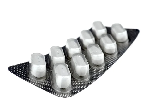 Pillen in Aluminium-Blisterverpackung isoliert auf weißem Hintergrund lizenzfreie Stockfotos