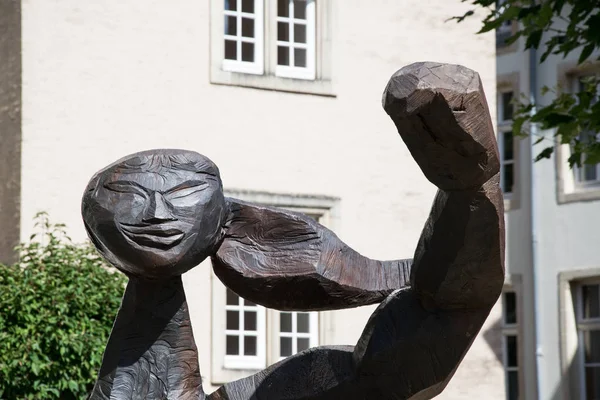 Part of a wooden figure. Discovered during a walk in luxembourg. The figure is a permanent fixture and is set up permanently for the general public