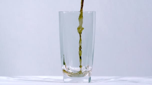 Dark cola splashing into glass — Stock Video
