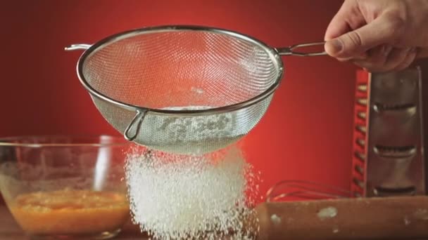 Sifting flour through sieve slow motion — Stock Video