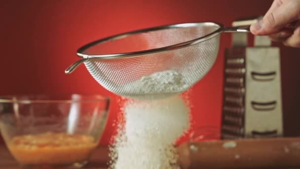 Sifting flour through sieve slow motion — Stock Video