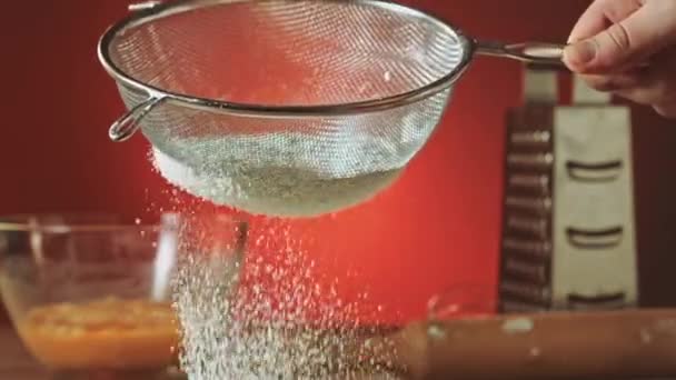 Sifting flour through sieve slow motion — Stock Video
