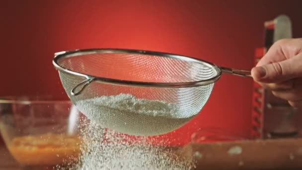 Sifting flour through sieve slow motion — Stock Video