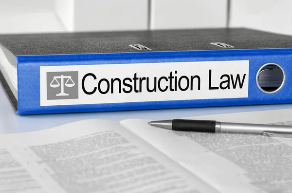 Modrá složka s popiskem stavební právo — Stock fotografie