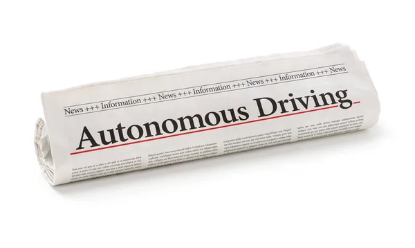 Periódico enrollado con el titular Autonomous Driving — Foto de Stock