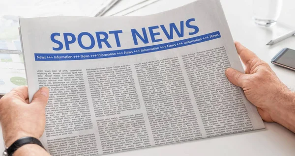 Man reading newspaper with the headline Sport News — Stock Photo, Image