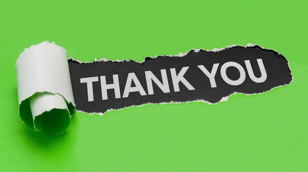 Torn green paper revealing the word Thank you — Stock Photo, Image