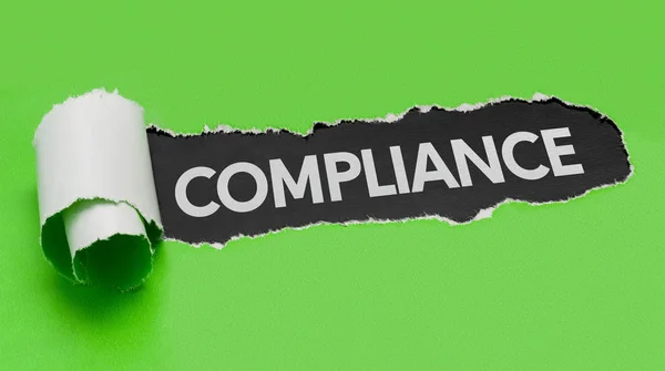 Torn green paper revealing the word Compliance — Stock Photo, Image
