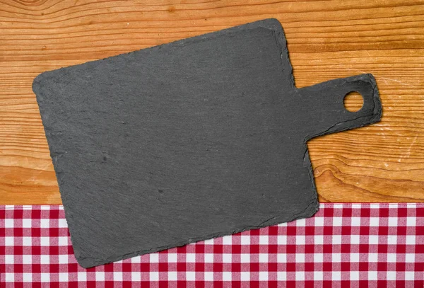 Empty blackboard with a red checkered tablecloth — Stock Photo, Image