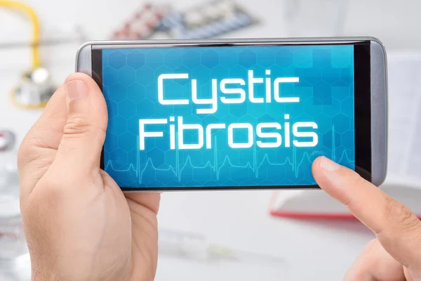 Smartphone with the text Cystic Fibrosis on the display — Stock Photo, Image