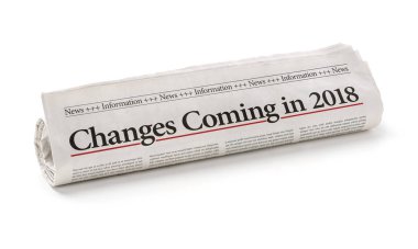 Rolled newspaper with the headline Changes coming in 2018 clipart