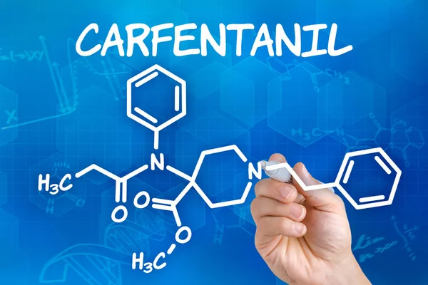 Hand with pen drawing the chemical formula of Carfentanil — Stock Photo, Image