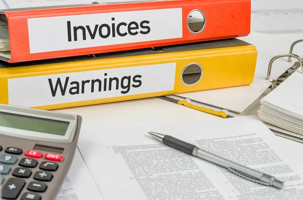 Folders with the label Invoices and Warnings — Stock Photo, Image